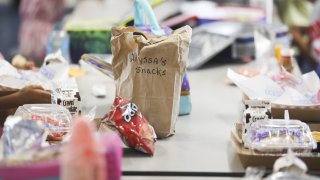 student lunches sit on a table in a Florida cafeteria