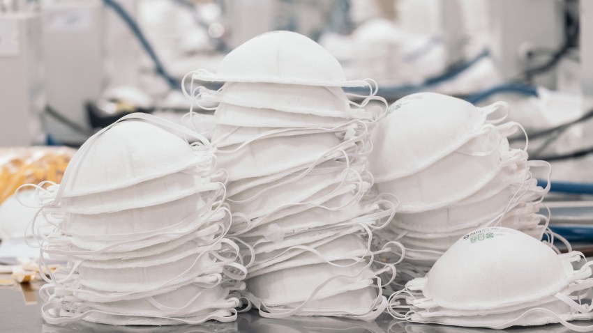In this May 26, 2020, file photo, a pile of N95 masks sit stacked on a table at the High Technology in Air Filtration (ATFIL) manufacturing facility in Xochimilco, Mexico City, Mexico.
