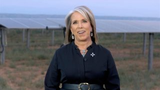 In this image from video, New Mexico Gov. Michelle Lujan Grisham speaks in front of solar panels during the third night of the Democratic National Convention on Wednesday, Aug. 19, 2020.