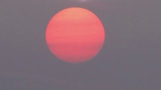 sunrise filtered by smoke in Connecticut