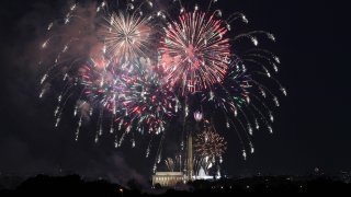 FILE - Fireworks are set off on the National Mall over the Washington Monument, Lincoln Memorial and U.S. Capitol Building as part of celebrations for the 4th of July in Washington, July 4, 2020.