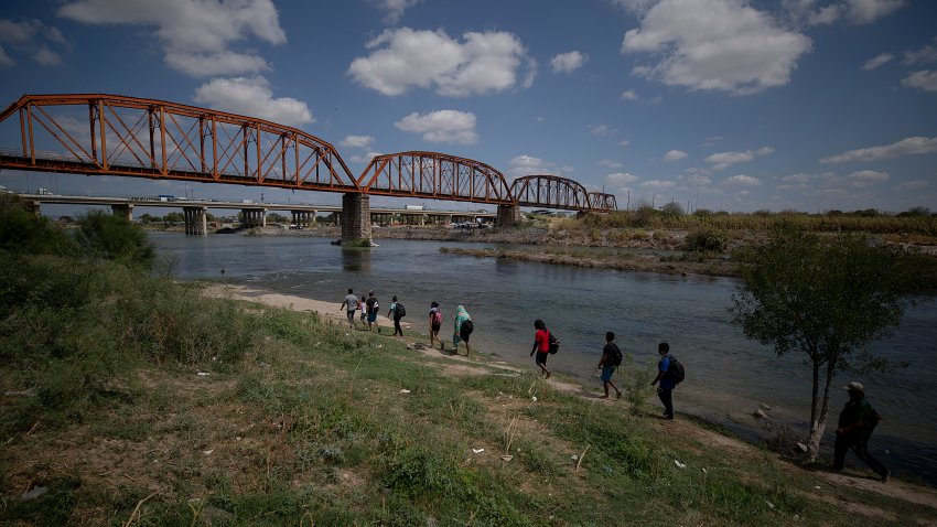 PIEDRAS NEGRAS, MEXICO – SEPTEMBER 22: Migrants prepare to cross the Rio Bravo by walking from the municipality of Piedras Negras on September 22, 2023 in Piedras Negras, Mexico. More than 5,000 migrants have crossed the border between Piedras Negras and Eagle Pass, Texas  since Monday, September 18 which has caused the deployment of the Border Patrol, CBP, the State Guard and National Guard. (Photo by Agencia Press South/Getty Images)