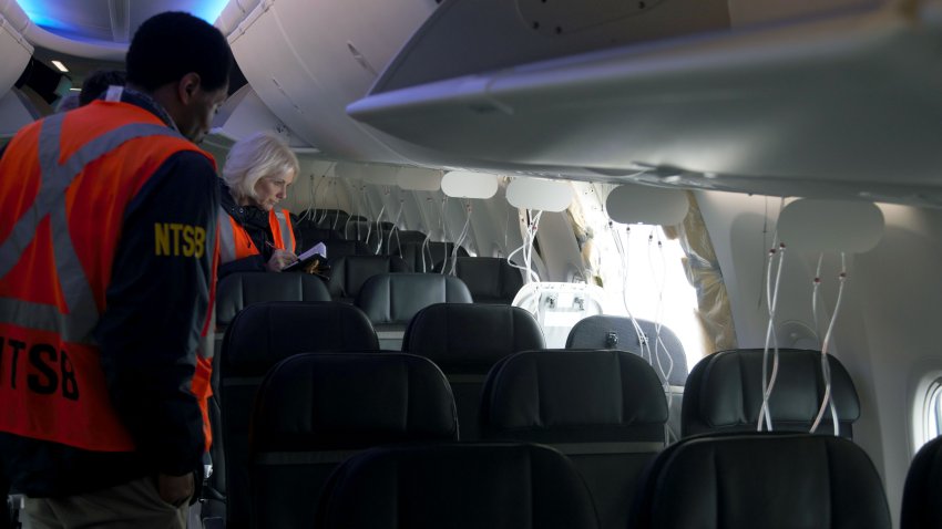 PORTLAND, OREGON – JANUARY 7: In this National Transportation Safety Board (NTSB) handout, members of the NTSB examine the hole in the fuselage plug area of Alaska Airlines Flight 1282 Boeing 737-9 MAX on January 7, 2024 in Portland, Oregon. A door-sized section near the rear of the Boeing 737-9 MAX plane blew off 10 minutes after Alaska Airlines Flight 1282 took off from Portland, Oregon on January 5 on its way to Ontario, California.  (Photo by NTSB via Getty Images)