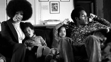LOS ANGELES, CA - JANUARY 8: NFL star O.J. Simspson talks on the phone while doing a portrait session at home with his wife Marguerite (Whitley) Simpson, daughter Arnelle and son Jason on January 8, 1973 in Los Angeles, California. (Photo by Michael Ochs Archives/Getty Images)