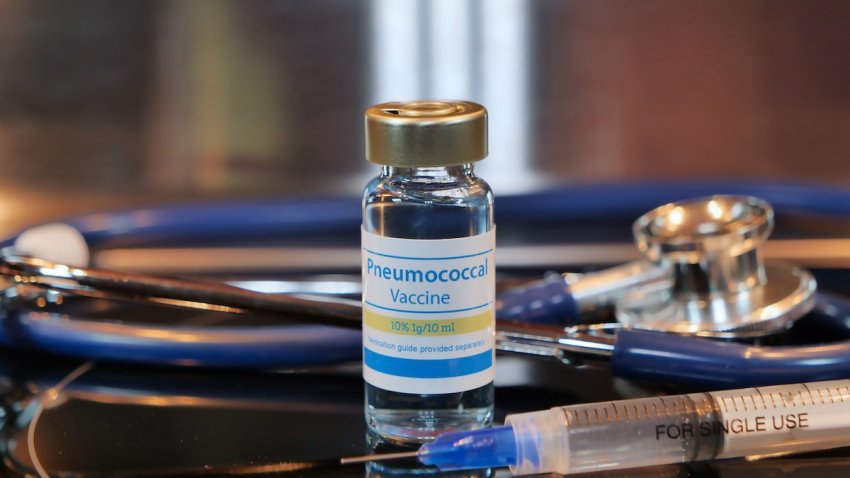 Vial of Pneumococcal vaccine on a stainless steel background