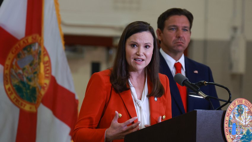 WEST PALM BEACH, FLORIDA – SEPTEMBER 17: Florida Gov. Ron DeSantis listens as Florida Attorney General Ashley Moody speaks during a press conference regarding an apparent assassination attempt of former President Donald Trump on September 17, 2024 in West Palm Beach, Florida. The Governor announced that the State of Florida’s law enforcement will do their own investigation into the incident, which the FBI said “appears to be an attempted assassination of former President Trump’ while he was golfing at Trump International Golf Club.  (Photo by Joe Raedle/Getty Images)