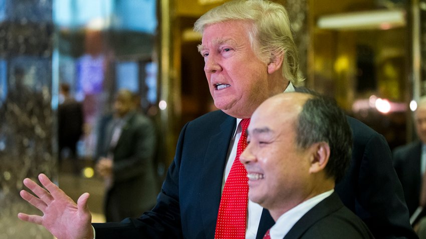 President-elect Donald Trump and SoftBank Group Corp. founder and Chief Executive Officer Masayoshi Son speak to the media in the lobby of Trump Tower on December 6, 2016 in New York. / AFP / Eduardo Munoz Alvarez        (Photo credit should read EDUARDO MUNOZ ALVAREZ/AFP via Getty Images)