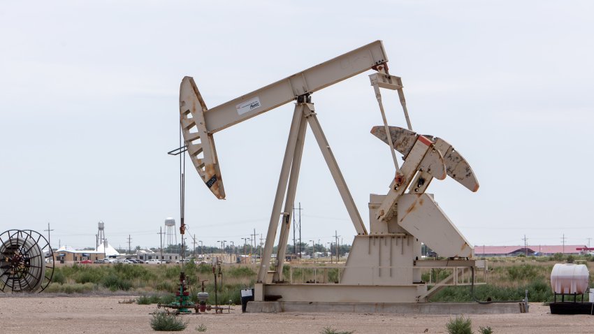 An oil pump jack operates near U.S. Route 285 outside Loving, New Mexico, U.S., on Tuesday, Aug. 6, 2019. New Mexico’s Governor Michelle Lujan Grisham is balancing her concern over the catastrophic effects of climate change with the state’s extraordinary dependence on oil and gas. Photographer: Steven St John/Bloomberg via Getty Images