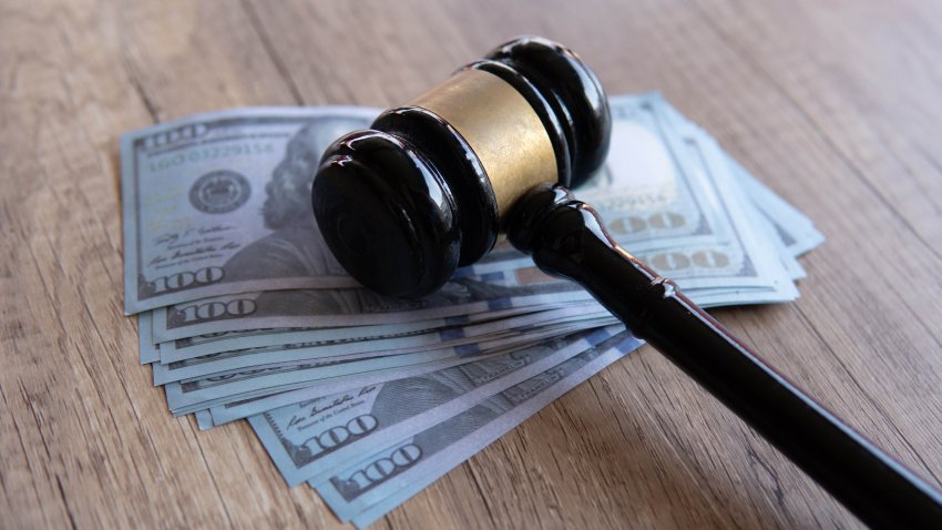 Closeup image of gavel and money. Fine, penalty, bribe concept.