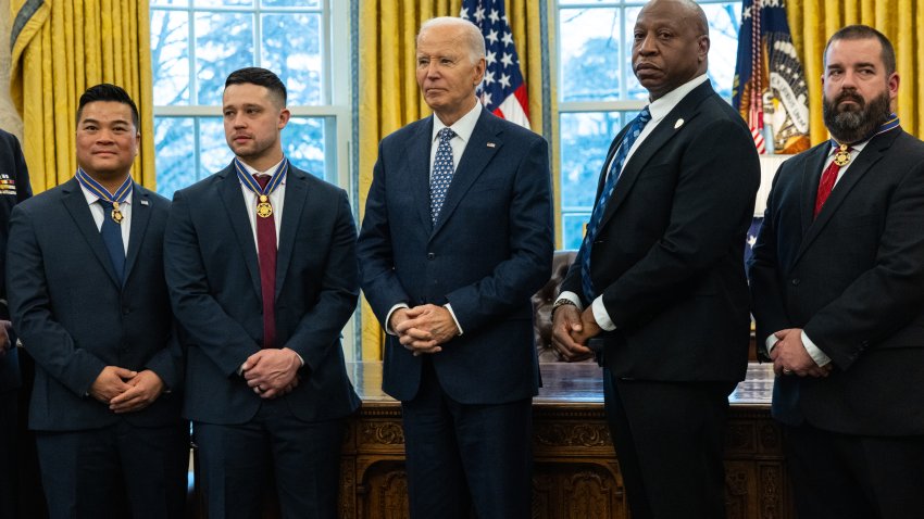 WASHINGTON, DC – JANUARY 3: U.S. President Joe Biden honors recipients with the Medal of Valor in the Oval Office at the White House on January 3, 2025 in Washington, DC. Honored in the ceremony were FDNY Firefighter Brendan Gaffney, FDNY Lieutenant John Vanderstar, Sergeant Tu Tran of the Police Department of Lincoln, Nebraska, and Detective Michael Collazo, Sergeant Jeffrey Mathes, Detective Zachary Plese, and Detective Ryan Cagle of the Nashville, Tennessee, Police Department. (Photo by Anna Rose Layden/Getty Images)